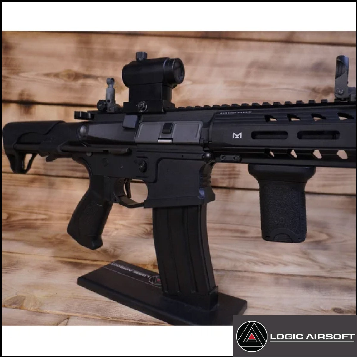 Black airsoft AEG rifle with scope and rail system, side view